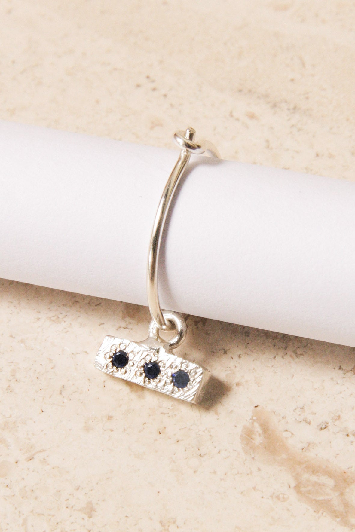 Silver Bedrock Charm Sleeper with Blue Sapphire